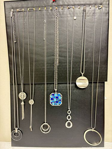 collection of silver-toned necklaces features various pendant styles, including geometric, (1 of 18)