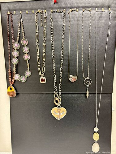  variety of silver toned and mixed-metal necklaces, including a prominent Juicy Couture  (1 of 17)