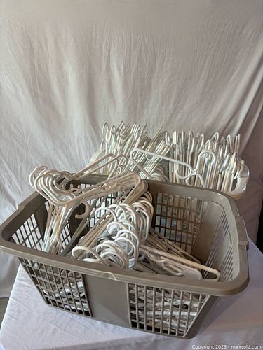 Clothes hangers in baskets (1 of 3)