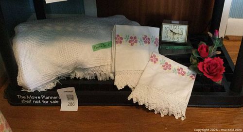 Mixed lot: linens, woven throw, Westclox alarm clock, porcelain figurine (1 of 6)