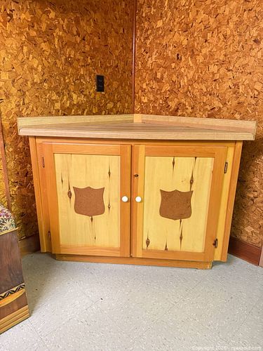 Corner Cabinet with Cork Insets and White Knob Hardware (1 of 3)
