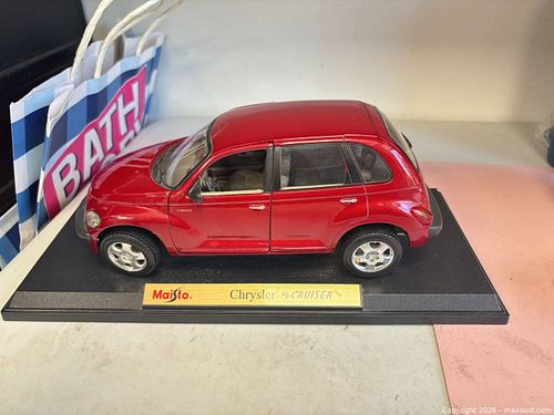 Maisto Special Edition 1:18 scale red die-cast collectible of a Chrysler PT Cruiser (1 of 6)