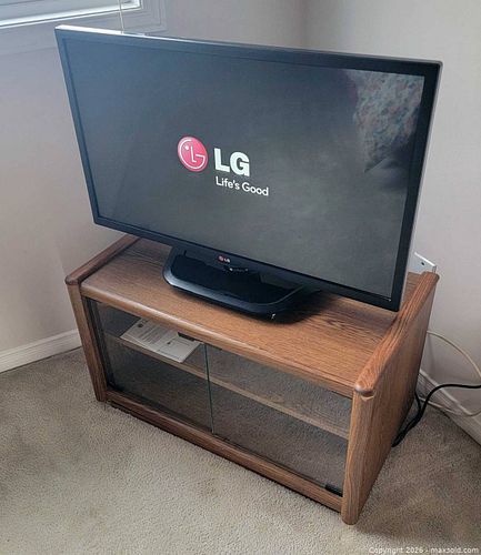 32" LG Smart TV with wooden swivel stand (1 of 1)