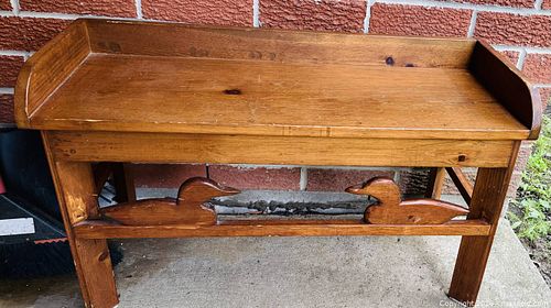 Handcrafted wooden bench with a warm brown finish. This piece has two decorative duck silhouettes (1 of 1)