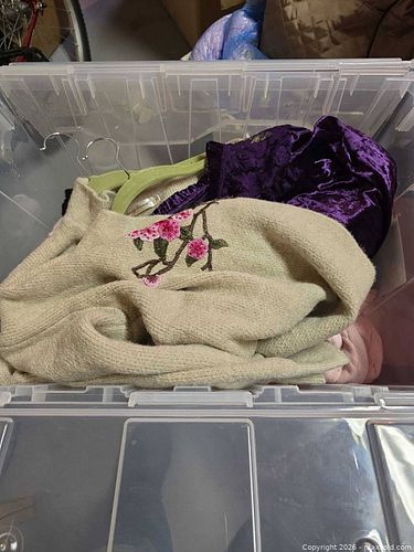 Lidded tote of clothing  (1 of 3)