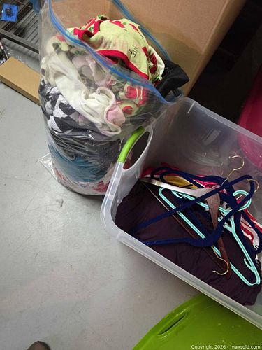 Lidded tote of clothing  (1 of 3)