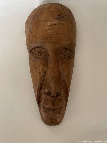 A Hand Carved Wooden Face. (1 of 3)