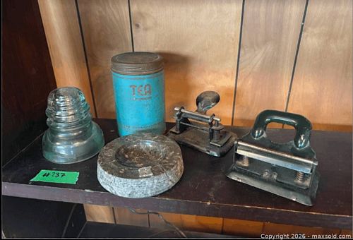 Mixed vintage collectibles: glass insulator, tea tin, ashtray, punches (1 of 3)