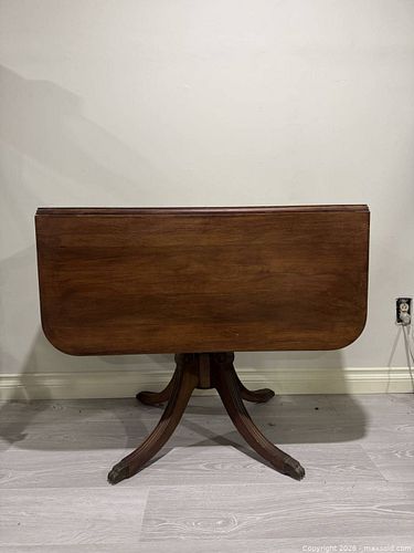 vintage Duncan Phyfe-style mahogany drop-leaf pedestal table (1 of 7)