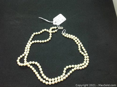 Thirty inch strand of real pearls with solid gold  clasp. (1 of 7)