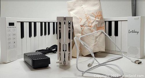 key FoldAble piano 88 with carrying case charging cord and attachable pedal (1 of 1)