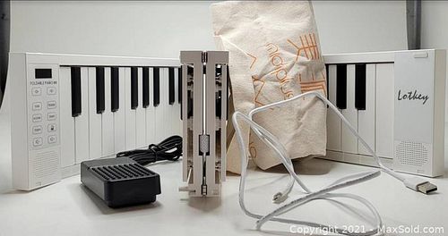 FoldAble piano 88 with carrying case charging cord and attachable pedal (1 of 1)