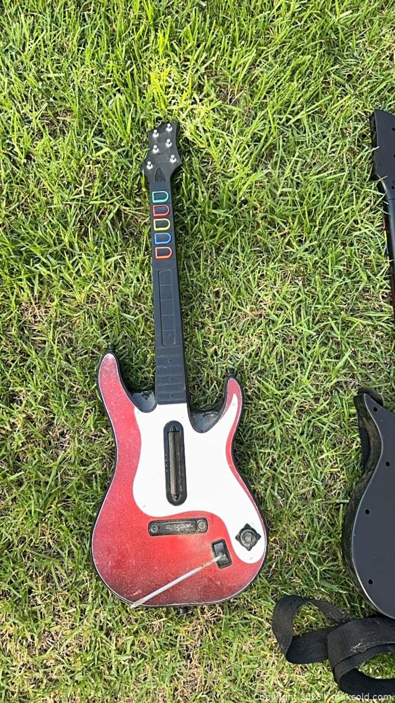 Five Guitar Hero and Rock Band guitar controllers | Maxsold