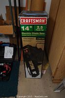 Craftsman box for 14 inch electric chain saw detailing 2.5 peak HP, assembled and with manual included.