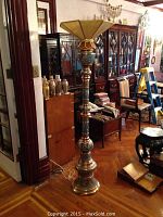 Full view of tall floor lamp in room setting