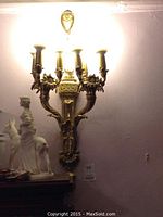 Illuminated first sconce, front view