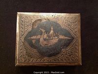 Top view of the rectangular vintage Siam sterling silver hinged trinket box with intricate niello inlay showing a traditional Thai boat and temple scene.