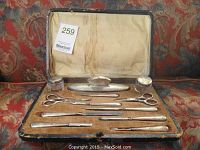 Open case showing all tools laid in velvet interior