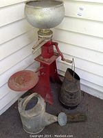 Wide shot showing all items in the lot: milk separator, charcoal bucket, watering can, and brass hardware.