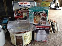 Photo showing Rival Crock Grill box, Otel Veg-o-Matic slicer box, Salton YM9 yogurt maker, and clear glass crock lid with wheat pattern crock pot base below.