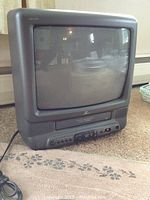 Front view of the Zenith CRT TV with built-in VCR, showing the screen and control buttons.