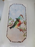 Full view of hand painted ceramic tile showing two birds on a branch with berries, set against sky background. Signature "Vera 1952" visible in lower right corner.