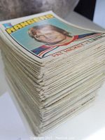 Stack of vintage OPC hockey cards showing edges and thickness of the collection.