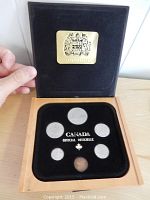 Open presentation box showing six coins arranged in a velvet insert labeled 'Canada Official Officielle'.