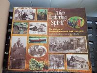 Front cover of the book titled 'Their Enduring Spirit: The History of Frontenac Provincial Park 1783-1990' showing a collage of historical photos