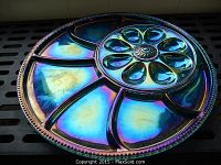 Top side view of the deep purple carnival glass deviled egg tray showing iridescent colors and egg compartments.