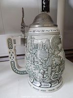 Side view of the ceramic stein showing the detailed medieval and Renaissance scenes with timeline and handle labeled '1000 Millennium'.