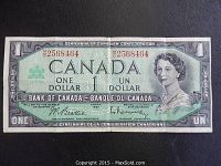 Front side of the 1967 Canadian one dollar banknote, showing portrait of Queen Elizabeth II, serial numbers, and Centennial logo.