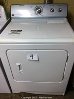 Front exterior view of the dryer showing door, control panel and cabinet