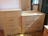 Photo showing the matching tall boy chest of drawers and dresser with mirror, highlighting size and construction.
