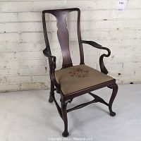 Full front view of miniature child’s armchair against white background