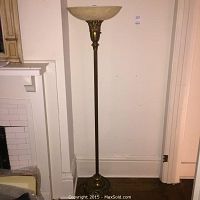 Full height view of the antique Art Deco torchiere floor lamp showing the tall ribbed column, wide frosted glass shade, and decorative base.