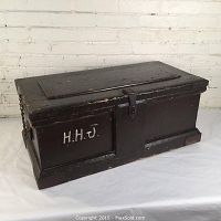 Front side view of the antique pine chest with brown paint, showing dovetailed construction and original hardware, with H.H.J. initials visible.