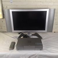 Full lot including TV, external tuner/DVD player unit, remote, and cables