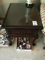 Front view of Gibbard mahogany side table with glass top and drawer