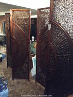 Front view of two assembled three-panel privacy screens