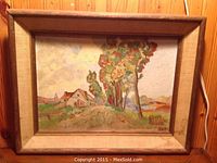 Full view of the oil on canvas rural landscape painting in wooden frame against a wood-paneled wall.