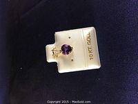 Pendant displayed on 10 KT GOLD labeled card, showing front view of the amethyst gemstone set in yellow gold.