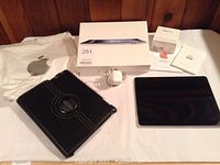 Overview of all included items: iPad, cases, accessories, packaging and documentation