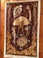 Batik wall hanging featuring bird, turtle, lizard, snake in cream and brown colors