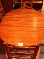 Top view of oval oak table with leaf installed