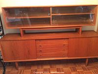 Front view of the full two-piece teak buffet.