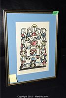 Full view of framed watercolor painting against black background