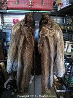 Front view of 3/4-length wolf fur jacket on mannequin