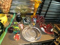 Overall view of all glass items on shelf