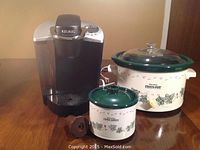 Full lot showing Keurig coffee maker, Rival 4 quart Crock Pot slow cooker, Rival dip server, and My K Cup reusable coffee filter on table